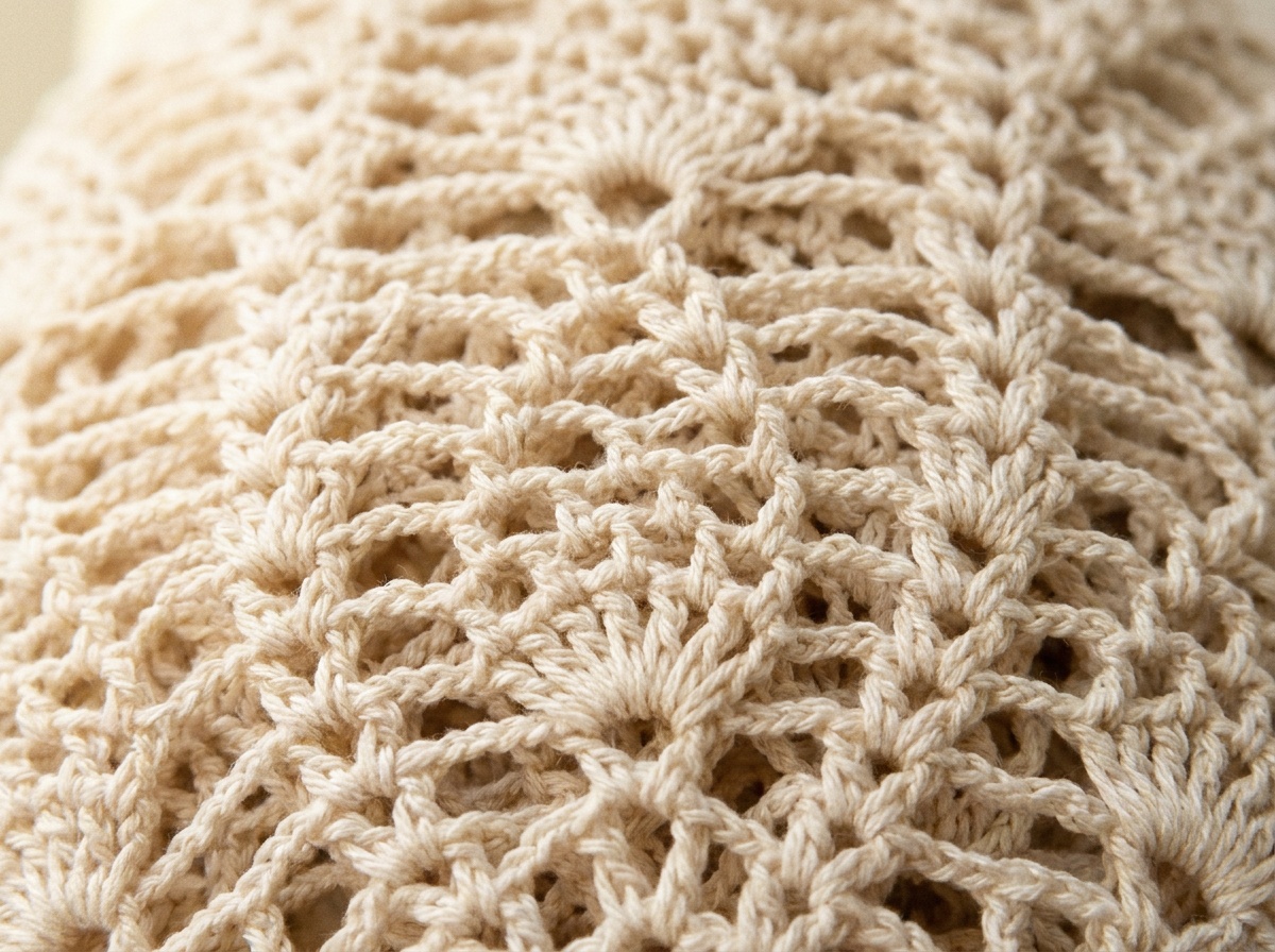 A worked swatch of Pineapple Stitch crochet, stitch texture visible